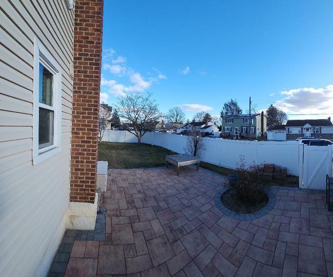 View of patio featuring a fenced backyard | Image 13