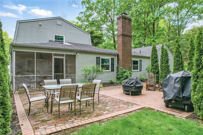 Perfect for quiet relaxation, or bustling entertaining! Screened in porch, brick paved patio, & privacy trees. | Image 42