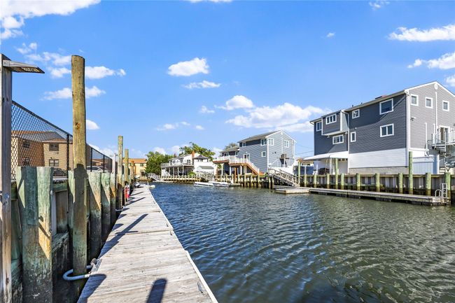 Dock featuring a residential view and a water view | Image 4