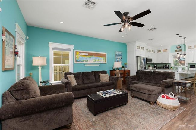 Living room featuring hardwood / wood-style floors and ceiling fan | Image 7