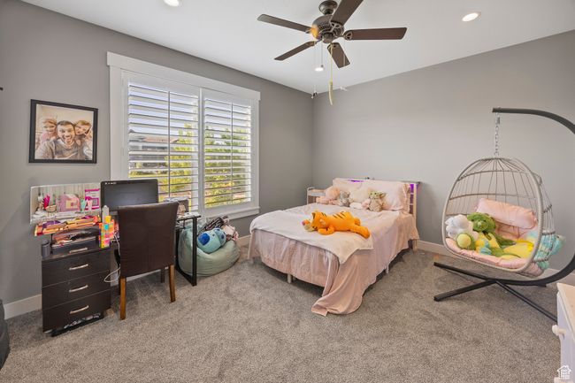 Carpeted bedroom featuring baseboards, recessed lighting, and ceiling fan | Image 45