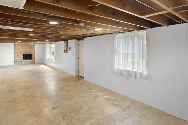 Plenty of room for a family room and additional bedroom on this side of the lower level. | Image 24