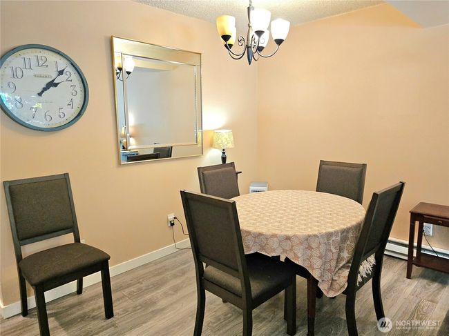 Dining room space can easily fit a large table. | Image 11