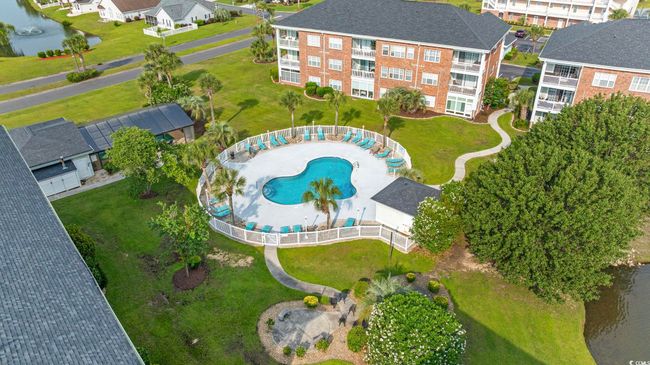 Aerial overview of property's location featuring a pool and a nearby body of water | Image 25