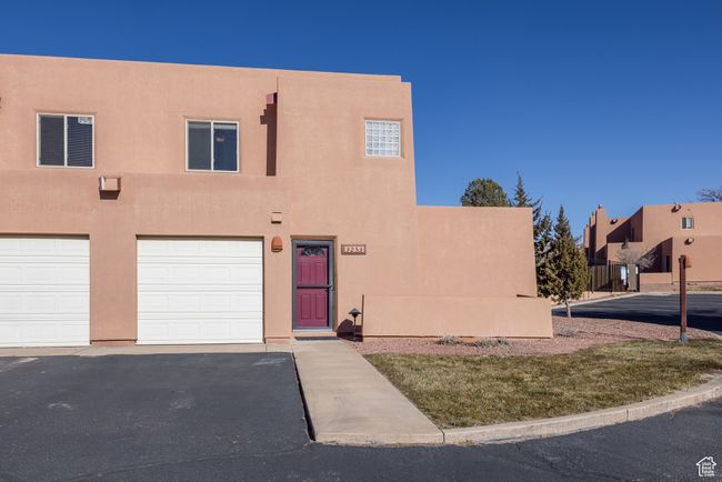 Adobe home featuring a garage | Image 33