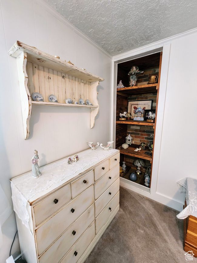 Room details with crown molding, a textured ceiling, and carpet | Image 36