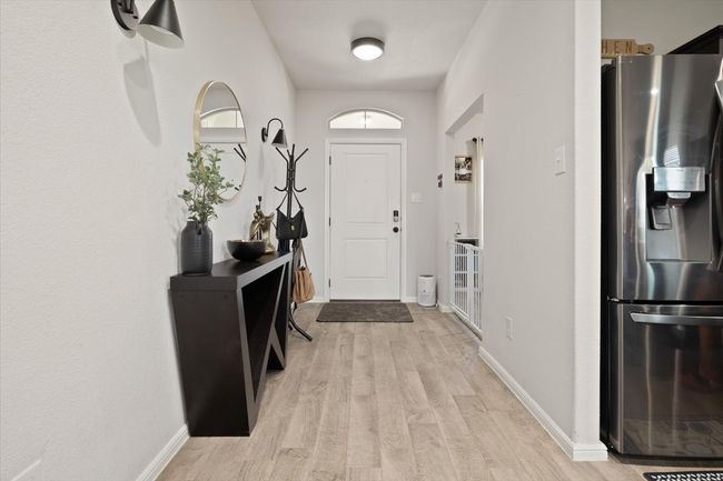 Entrance foyer with light ceramic tile floors and baseboards | Image 10