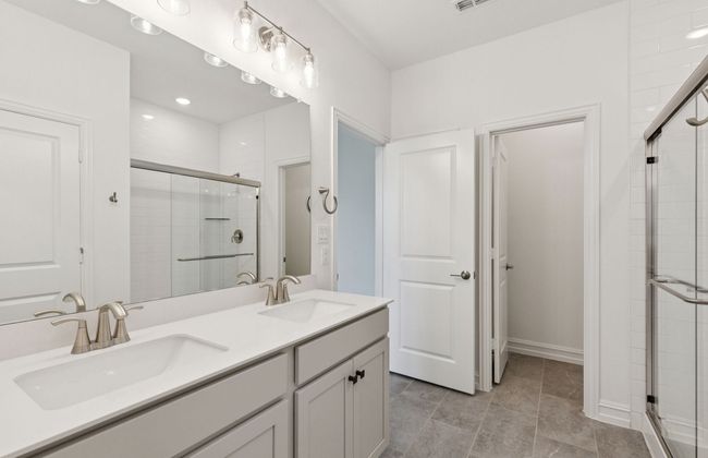 Owner's bath designed with a double vanity and oversized shower *Real home pictured | Image 11