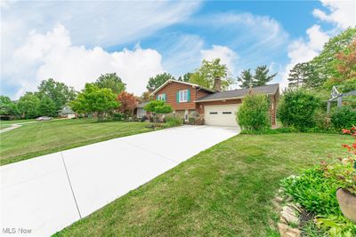 View of front of home featuring a garage and a front lawn | Image 2