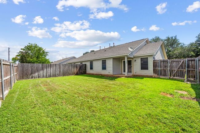 Back of property with a fenced backyard and a shingled roof | Image 32