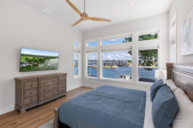 Primary Bedroom featuring water views. | Image 23