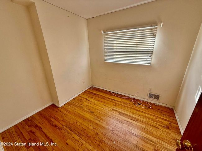 Spare room featuring light hardwood / wood-style floors | Image 6