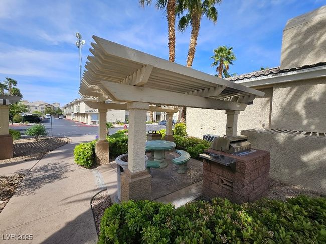 View of patio / terrace featuring a pergola and a residential view | Image 8
