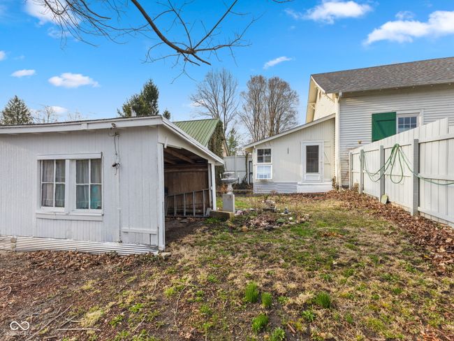 view of yard featuring an outbuilding and fence | Image 36