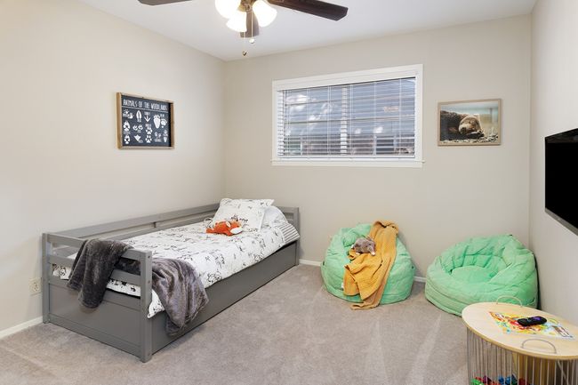 Carpeted bedroom with baseboards and ceiling fan | Image 24