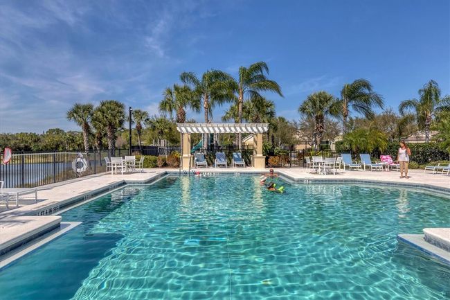 Pool area surrounds the pond | Image 47