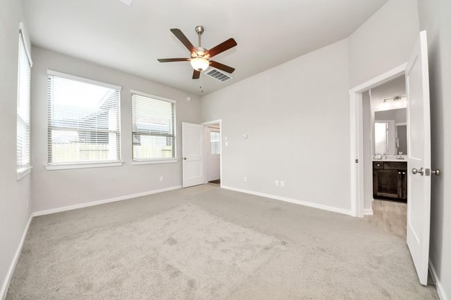 Large primary suite with tray ceilings and plenty of natural ligh | Image 25