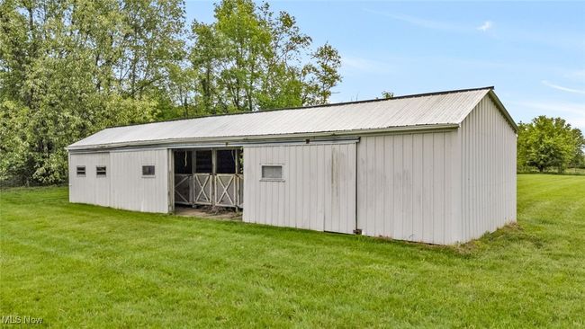 View of pole building featuring a lawn | Image 27
