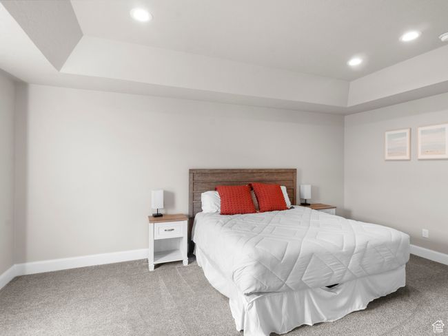 Carpeted bedroom featuring recessed lighting, a tray ceiling, and baseboards | Image 12