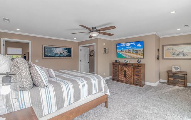 Carpeted bedroom featuring ornamental molding, recessed lighting, and ceiling fan | Image 24