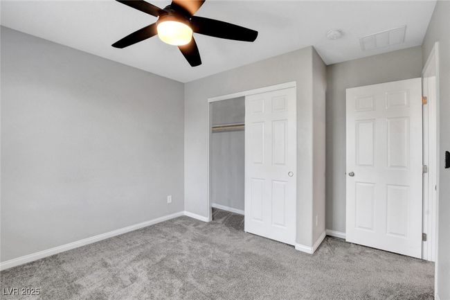 Unfurnished bedroom featuring carpet flooring, a closet, baseboards, and ceiling fan | Image 33