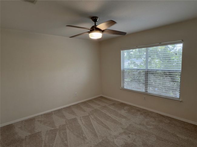 Unfurnished room with a ceiling fan and light carpet | Image 28