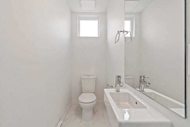 Half bath featuring toilet and marble finish floors | Image 14