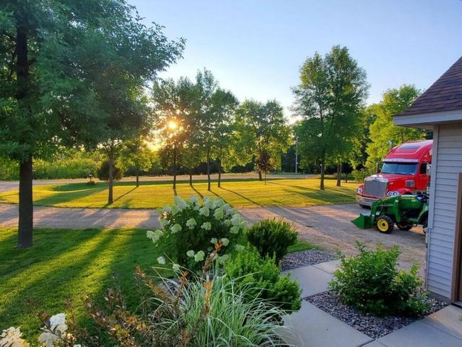 This is a taste of what summer sunsets are like. You'll love the landscaping and the shade trees on the property. | Image 45