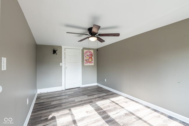 unfurnished room featuring baseboards, a ceiling fan, and wood finished floors | Image 26