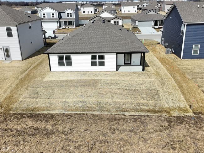 kitchen featuring a center island with sink, recessed lighting, appliances with stainless steel finishes, dark wood-style floors, and white cabinets | Image 14