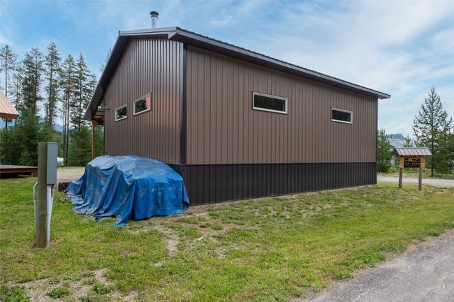 View of home's exterior with a yard | Image 52