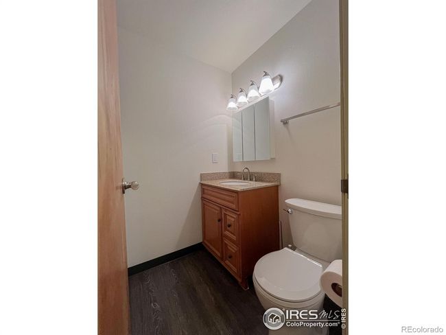 Updated bath with new flooring, vanity sink, toilet and lighting | Image 23
