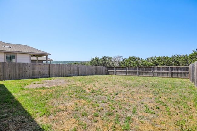 View of yard featuring a fenced backyard | Image 31