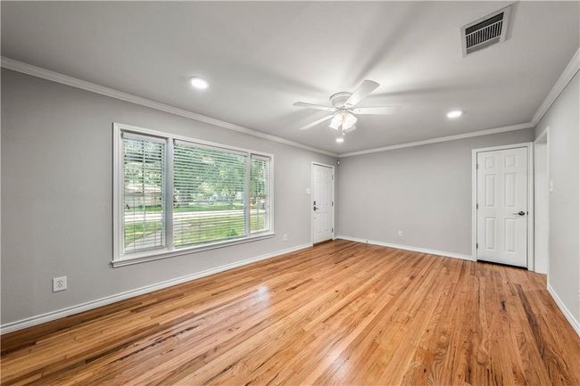 A look into the formal living room after floors were refinished but before Phase II of the project began. Notice the new windows in the subsequent and prior photos. | Image 7