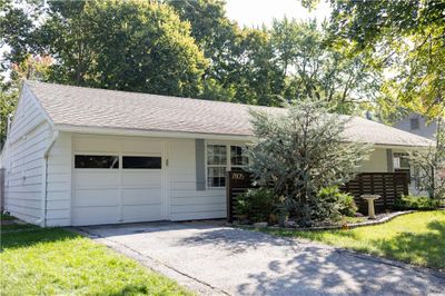 Ranch-style home featuring a garage | Image 3