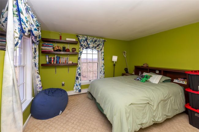 Bedroom with baseboards and carpet floors | Image 34