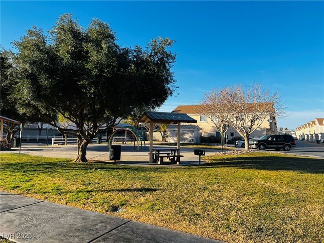 View of home's community with a yard | Image 19