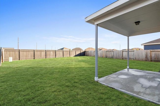 Covered patio and huge backyard with no neighbors in the back. | Image 31