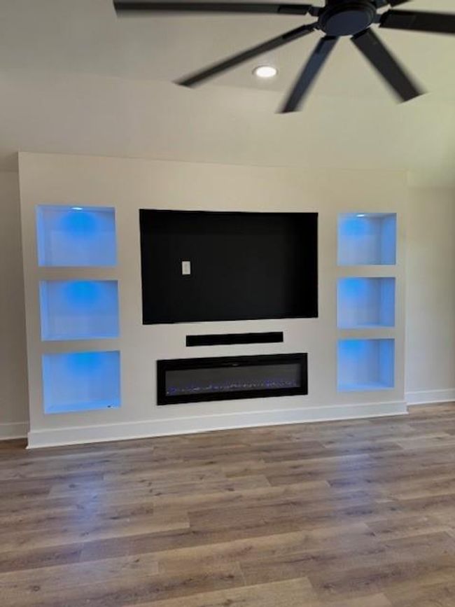 Beautiful Custom Built Entertainment Center with electric fireplace, controller for multicolor lights and space for a large tv. | Image 26