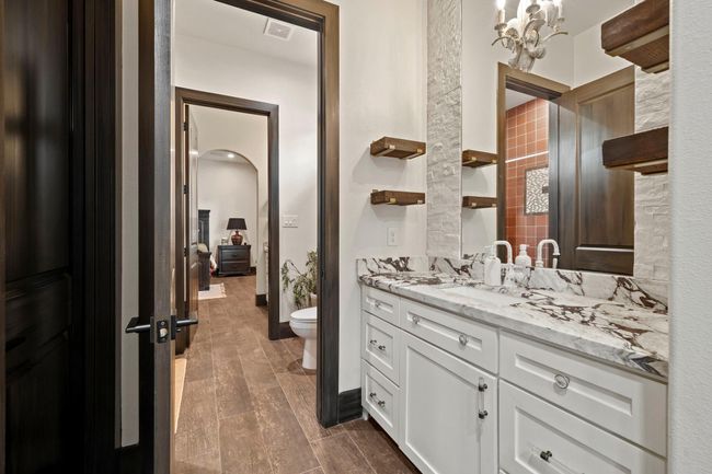 View of jack and jill bath looking into bedroom in previous photo. | Image 32