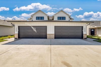 View of front of house with a garage | Image 1