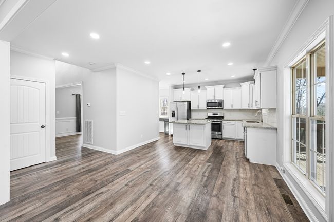 Kitchen with plenty of cabinet space and island for food prep. | Image 28