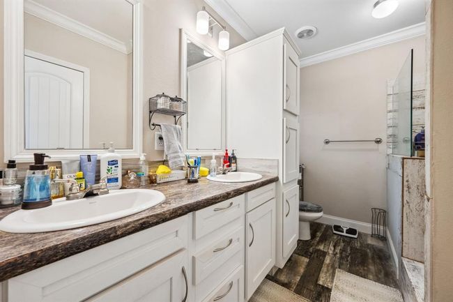 The primary bath boasts dual sinks and an extra large spa-like shower! | Image 21