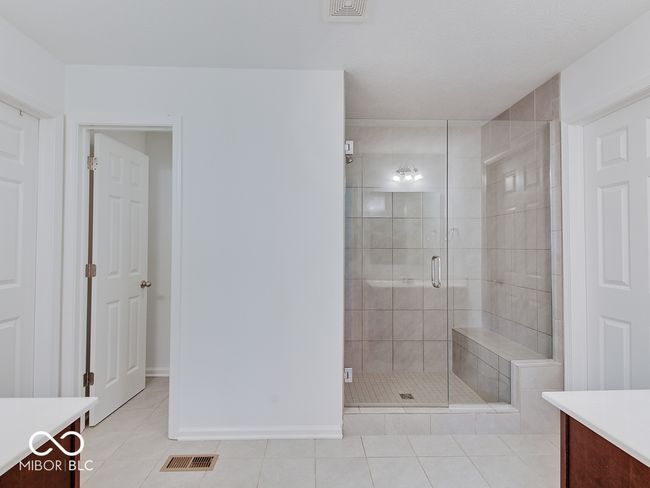 Ensuite bathroom featuring full shower | Image 35