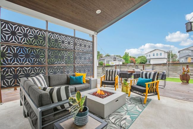 View of patio / terrace with an outdoor living space with a fire pit and a wooden deck | Image 33