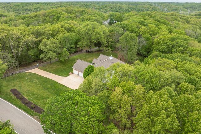 Birds eye view of property featuring a wooded view | Image 61