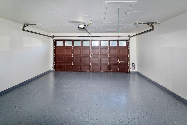 Garage featuring baseboards and a garage door opener | Image 27