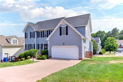 View of front of home featuring a front lawn and a garage | Image 3