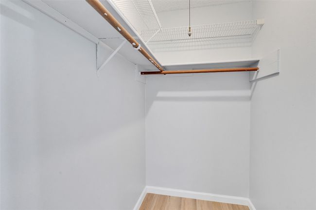 Walk-in closet in primary bedroom | Image 22