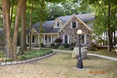 This home has stone and vinyl on the exterior | Image 2